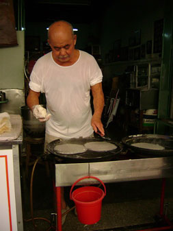 this man makes spring roll skins by hand!