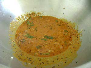 Add in curry powder paste and simmer