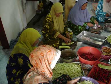 Malay women preparing food