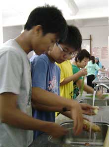 boys washing potatoes