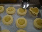 placing jam on pineapple tarts