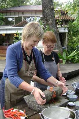 Grinding fresh spices with the granite slab.