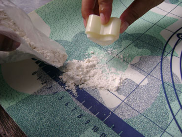 coating the cutter with flour